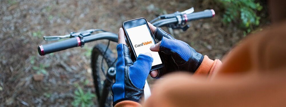 man using card valet while biking