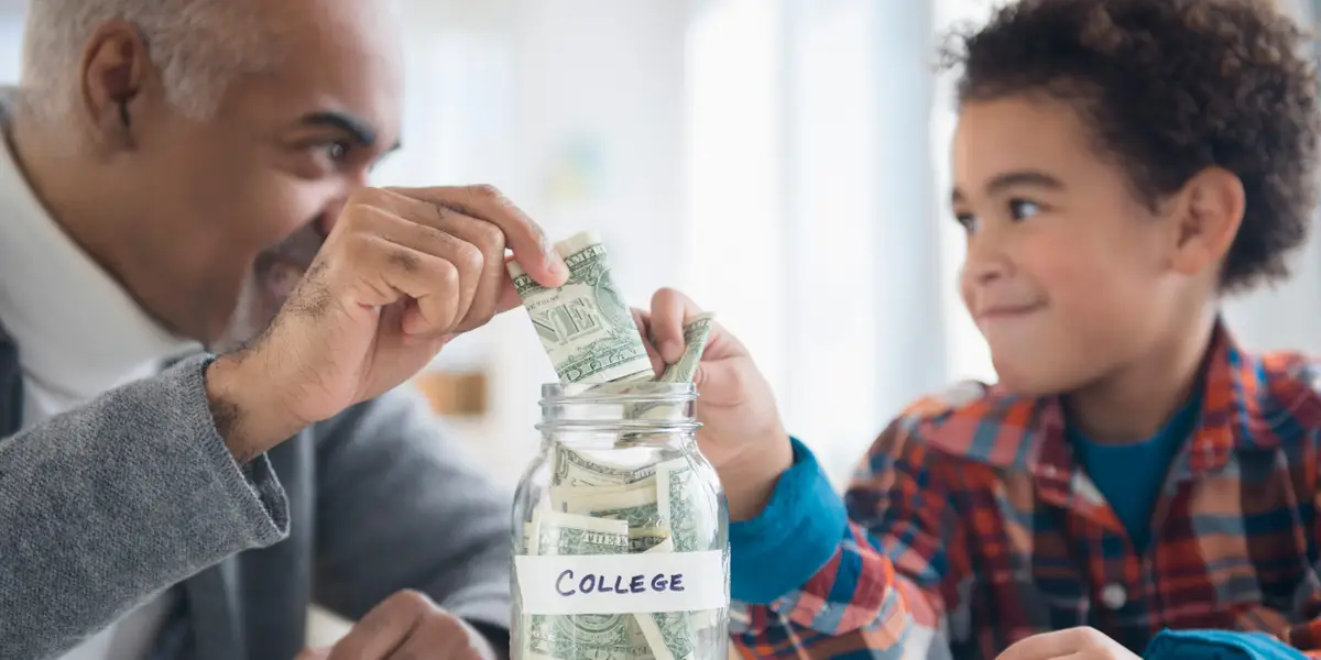 adult and child putting money into jar labeled college